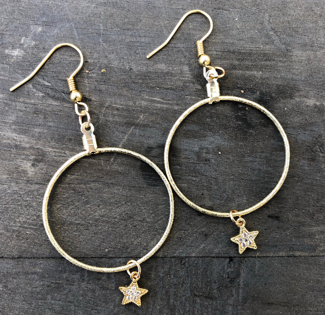 Gold plated 1 inch hoops with Swarovski star pendants